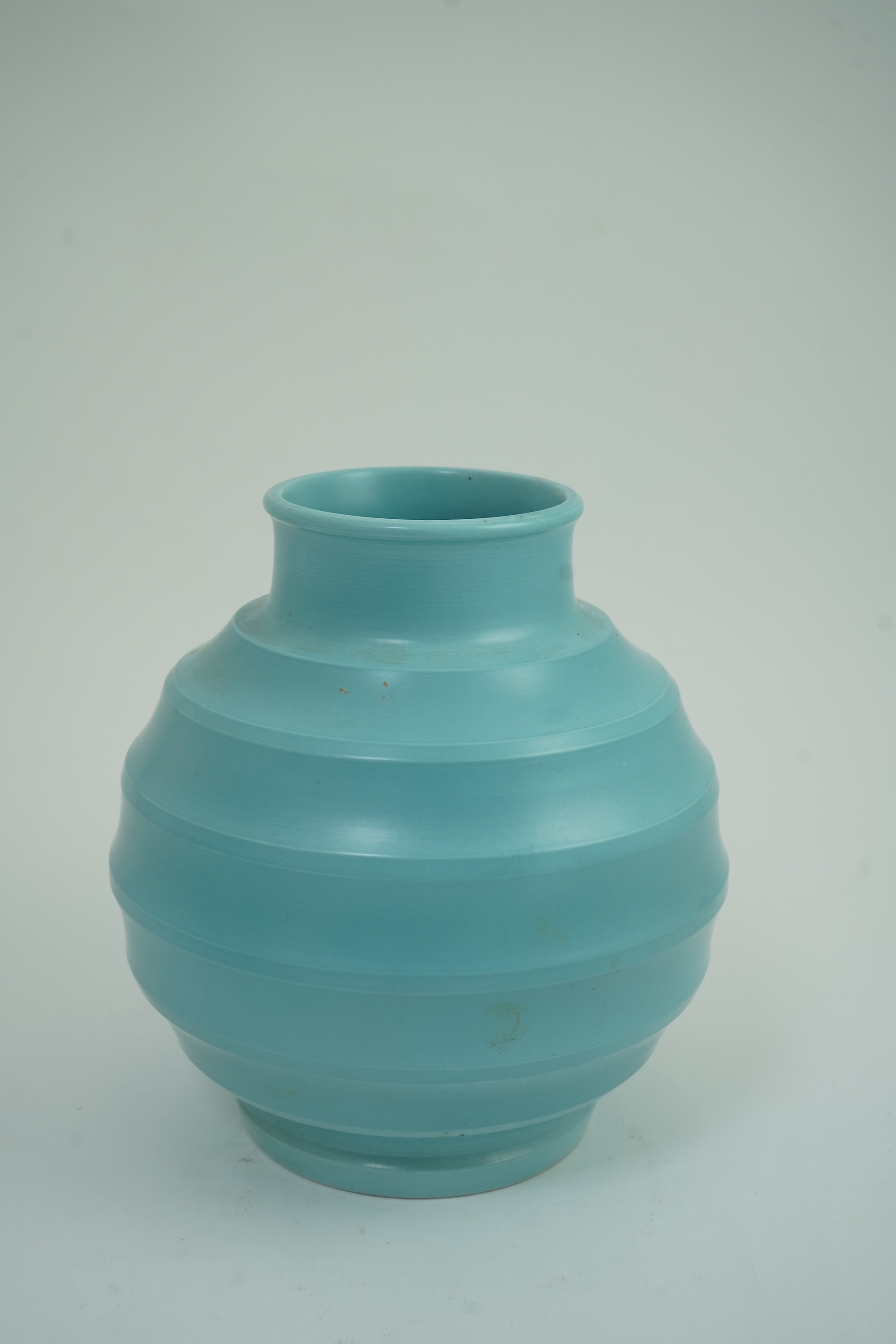 Keith Murray MC RDI FRIBA (New Zealand/British, 1892-1981) for Wedgwood: A matt blue glazed globe vase